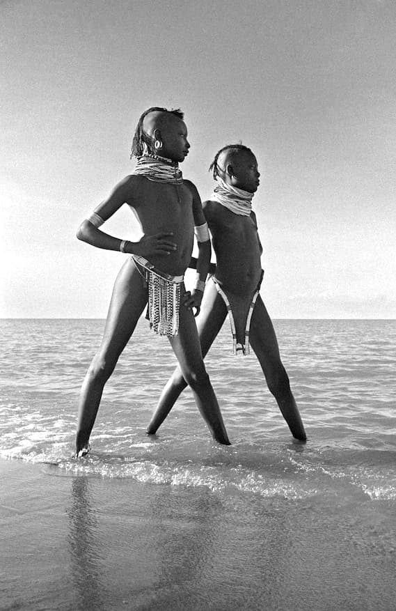 Two Young Turkana Girls Standing on the Shore of Lake Turkana
