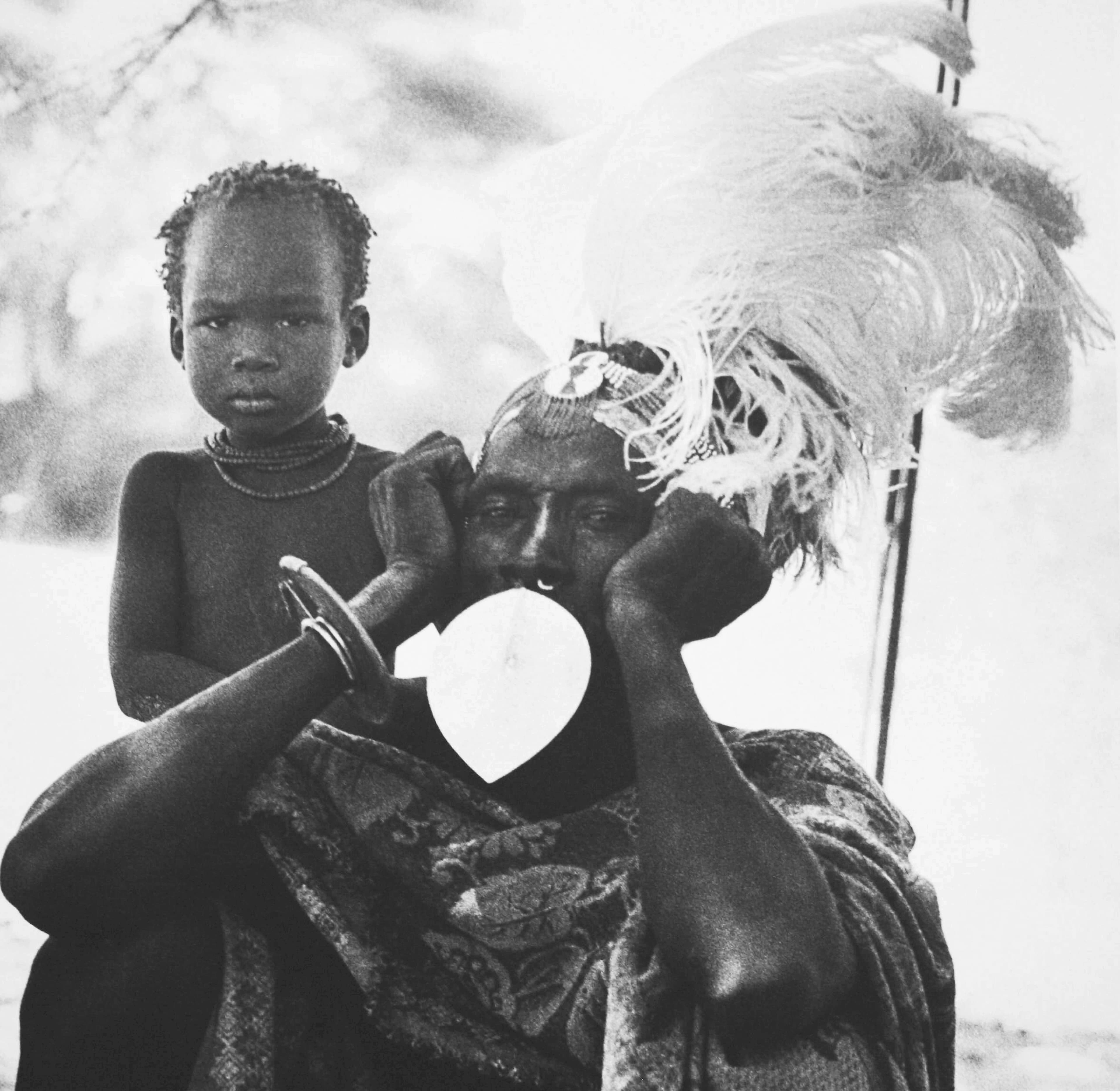 Turkana Father in Feathers with Child