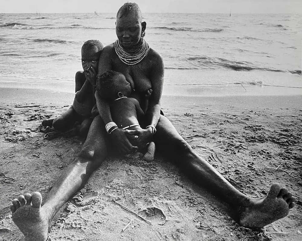 Turkana Woman with Two Babies sitting by the Lake