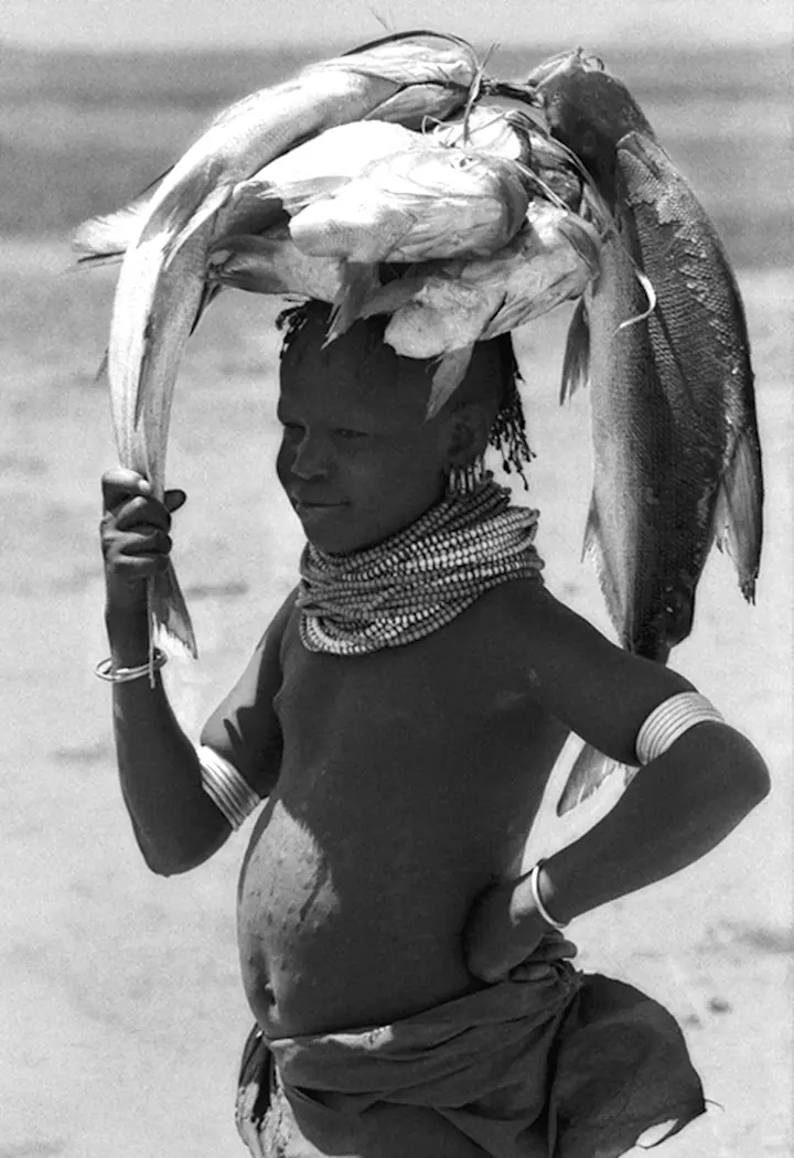Turkana Girl Carrying Bundle of Fish